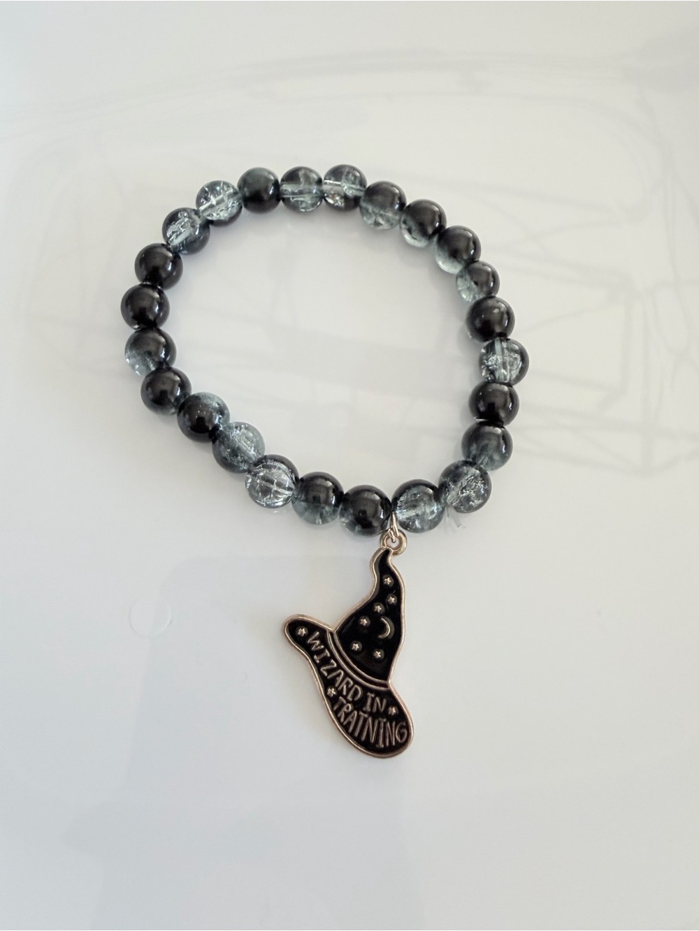 Black and Gray Beaded Bracelet with Wizard Hat Charm